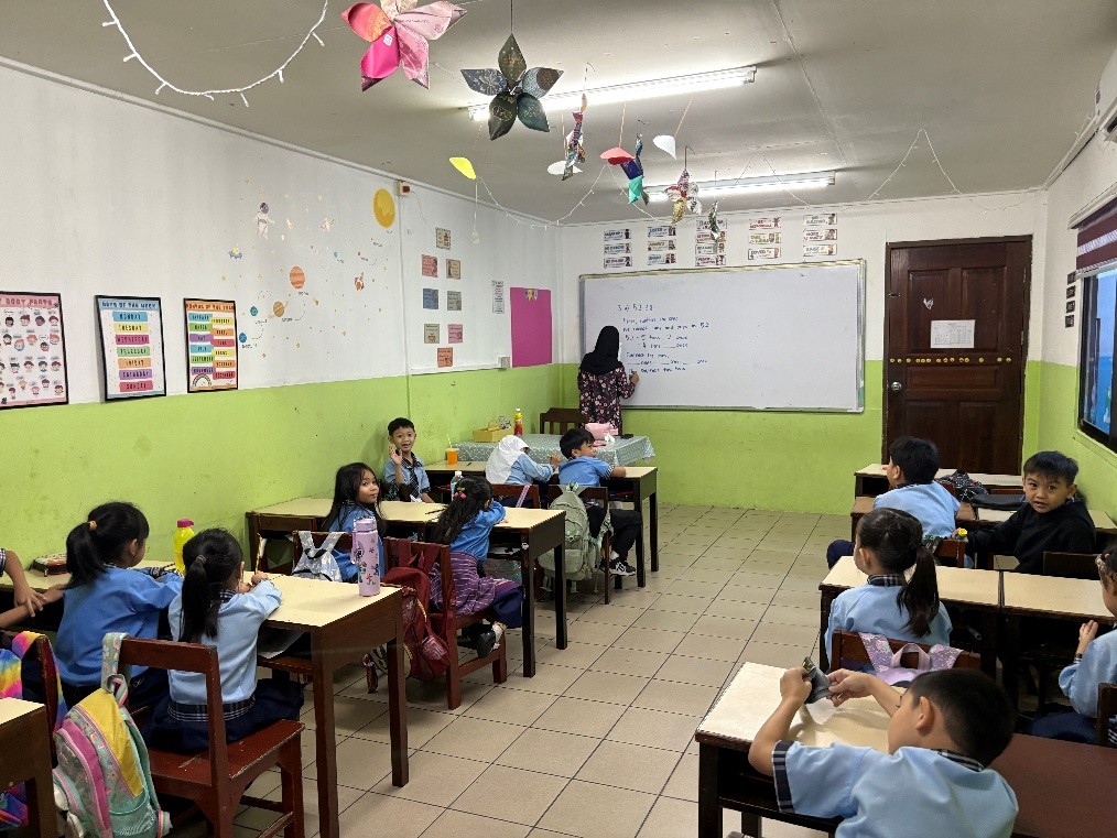 Teacher guiding students during a lesson